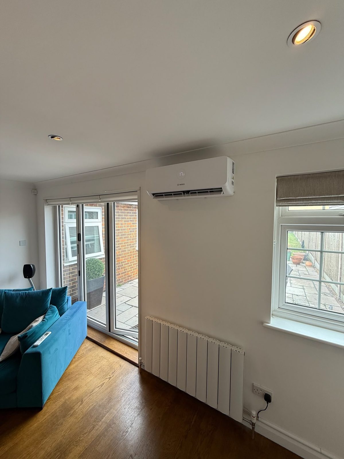 Bosch wall-mounted air conditioning unit installed in a living room
