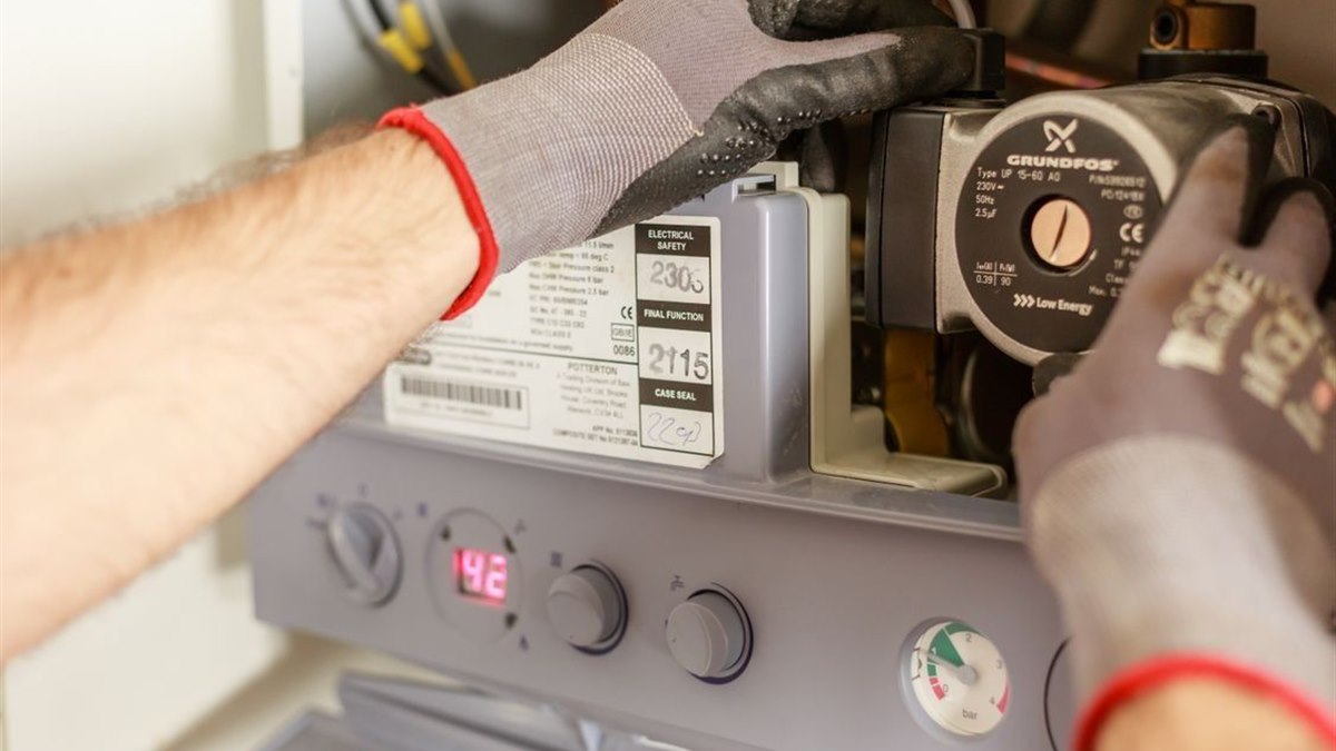 Engineer servicing a domestic boiler